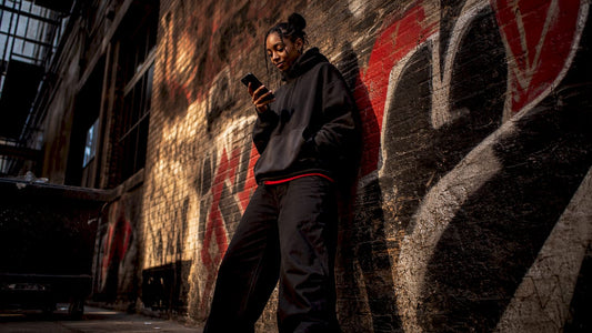Woman in oversized streetwear on city street