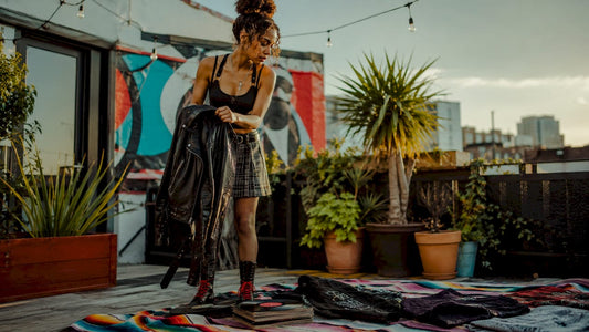 Young woman styling music-inspired outfit indoors