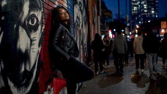 Woman mixing streetwear and luxury fashion outdoors